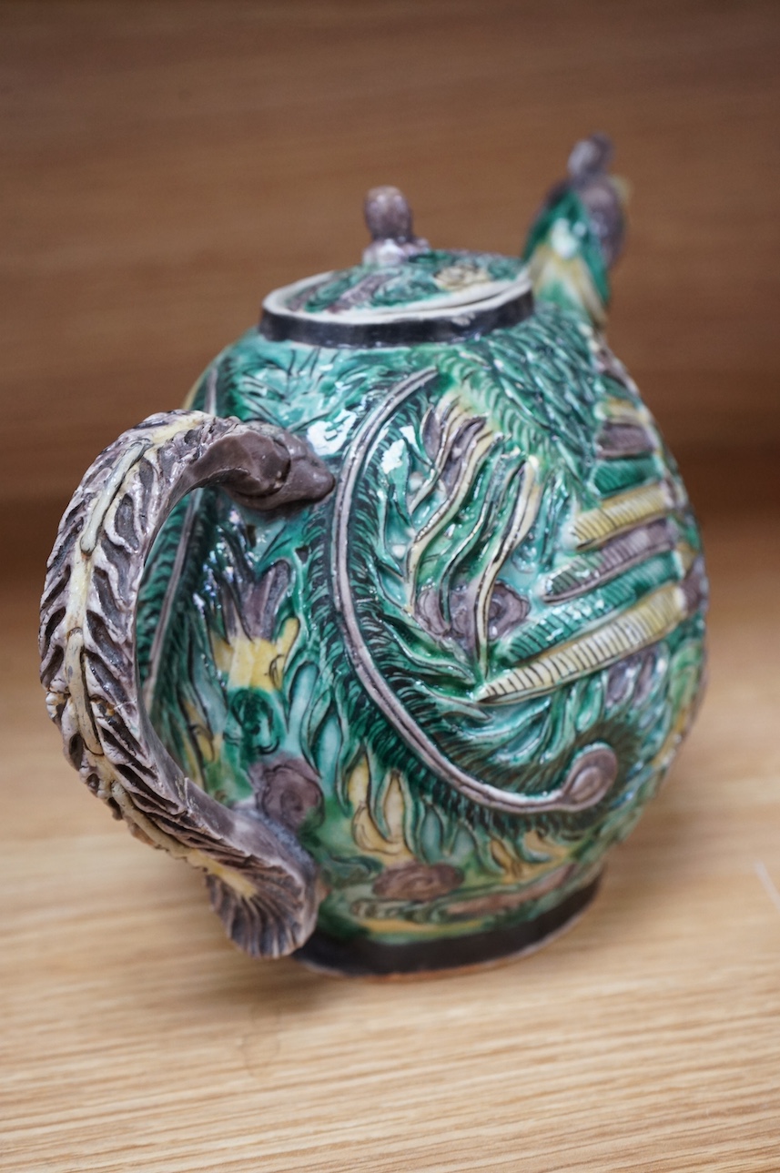 A Chinese susancai teapot in the form of a phoenix, Qianlong mark but 19th century, 15cm high. Condition - fair, repair to handle.